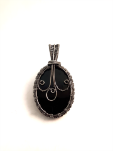 uniquely black silver woven zig zag pendant back