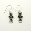 infinity garnet silver drop earrings close up