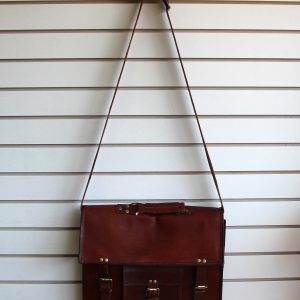 Leather briefcase hanging on slatwall