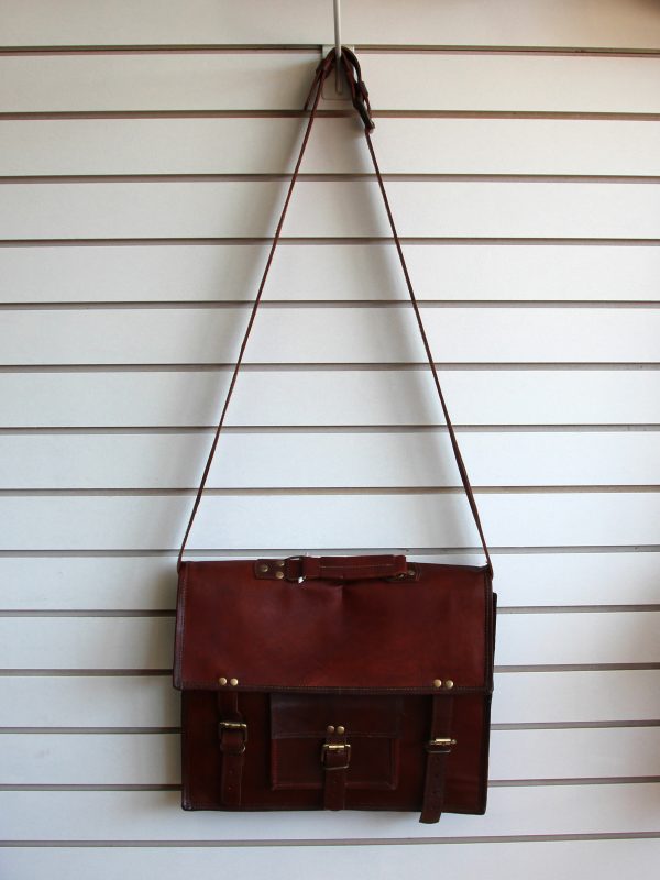 Leather briefcase hanging on slatwall