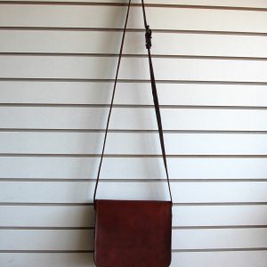 Leather purse hanging on slatwall